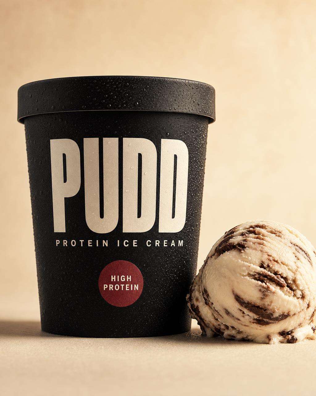 PUDD Protein Ice Cream concept packaging in matte black with cream PUDD wordmark